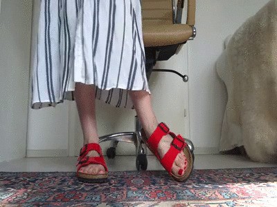 Red patent leather slippers with a long summer dress